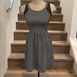 Black and white sleeveless flare dress